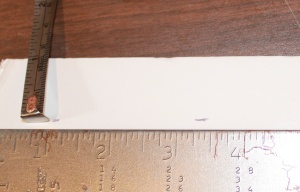 Remember to do two marks (at one inch, here) for the length of the hanger. This is for cutting a straight line.