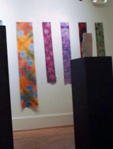 Row of silk scarves