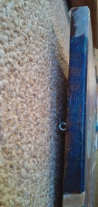 Mind the gap: eyelets screwed on outside of frame create a gap against the wall.